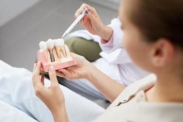 maple grove dentist showing patient dental implants 