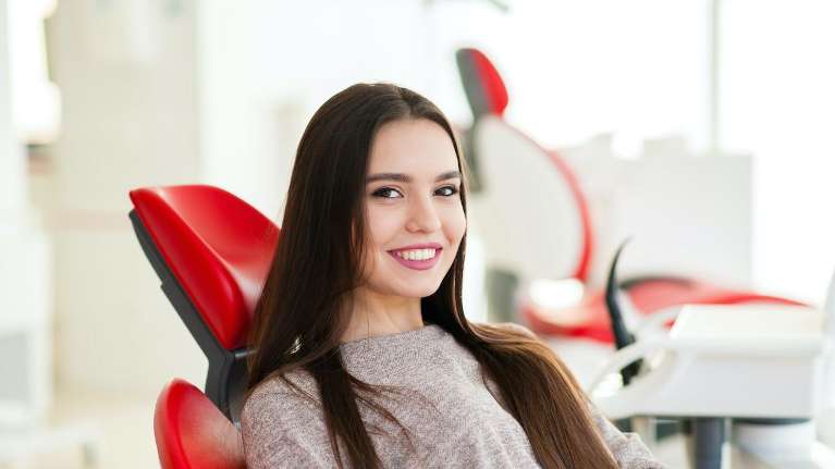 girl in her maple grove dentist chair